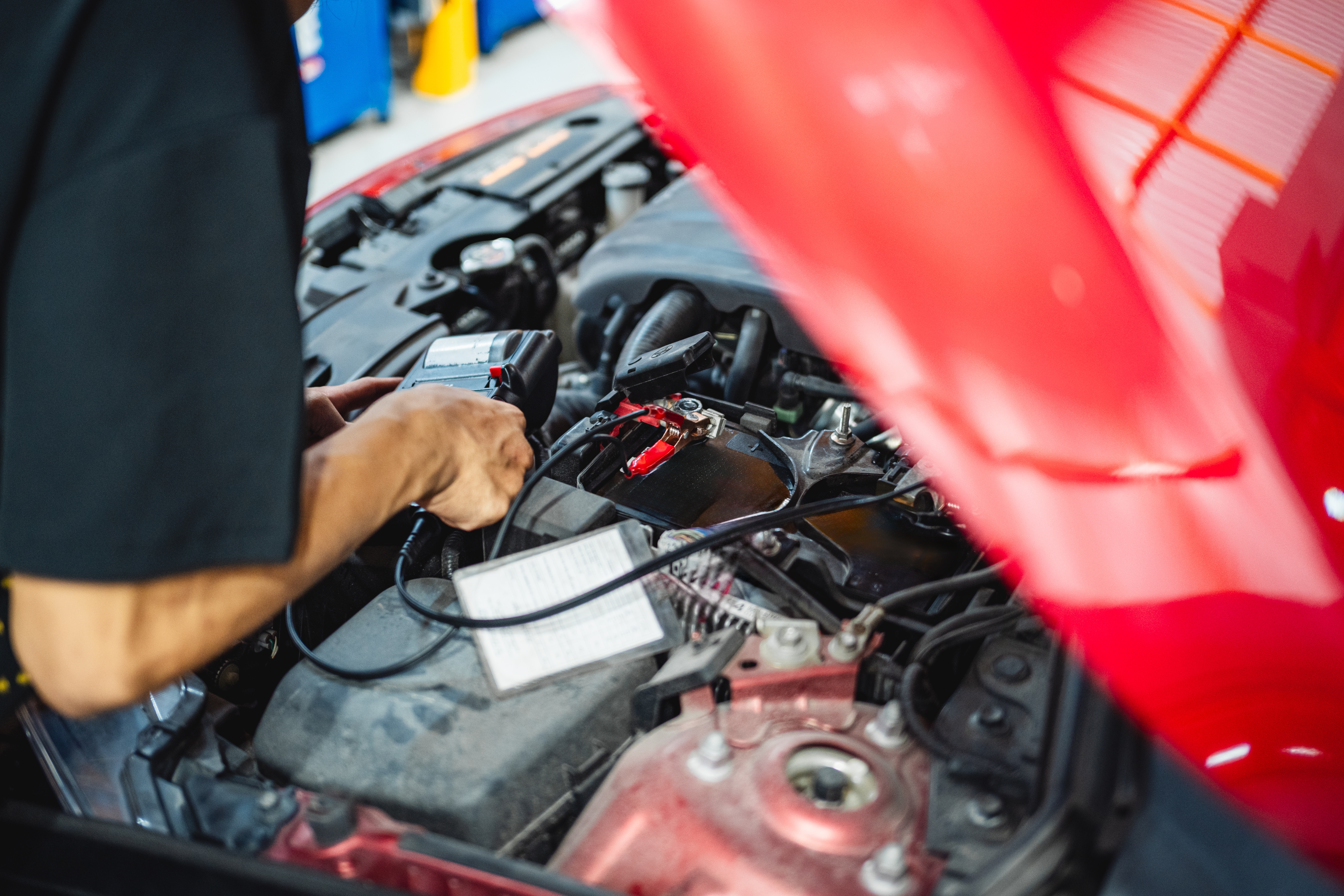 engine repair in monticello by Strokers Diesel & Automotive, a mechanic repairing an engine