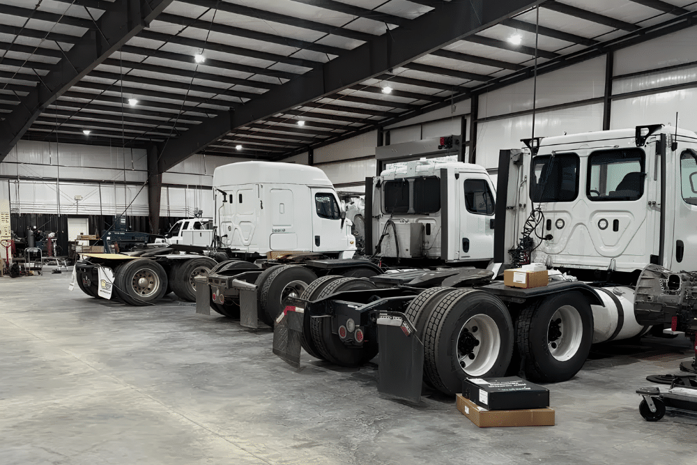 Fleet Maintenance in Monticello, AR At Strokers Diesel Performance & Repair. Image of Heavy-duty fleet vehicles receiving routine maintenance